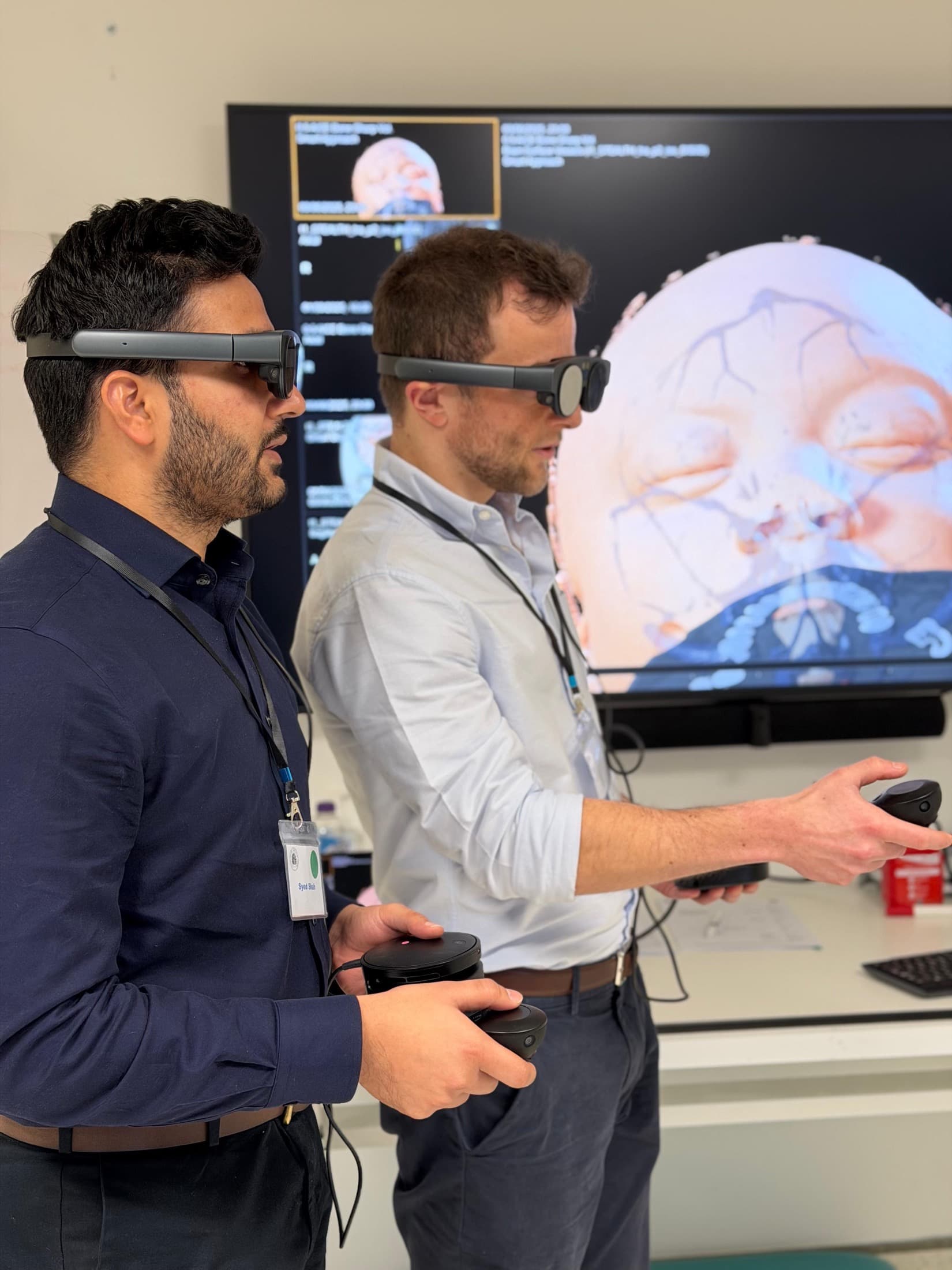 George Hudson using augmented reality headsets to review a 3D skull model